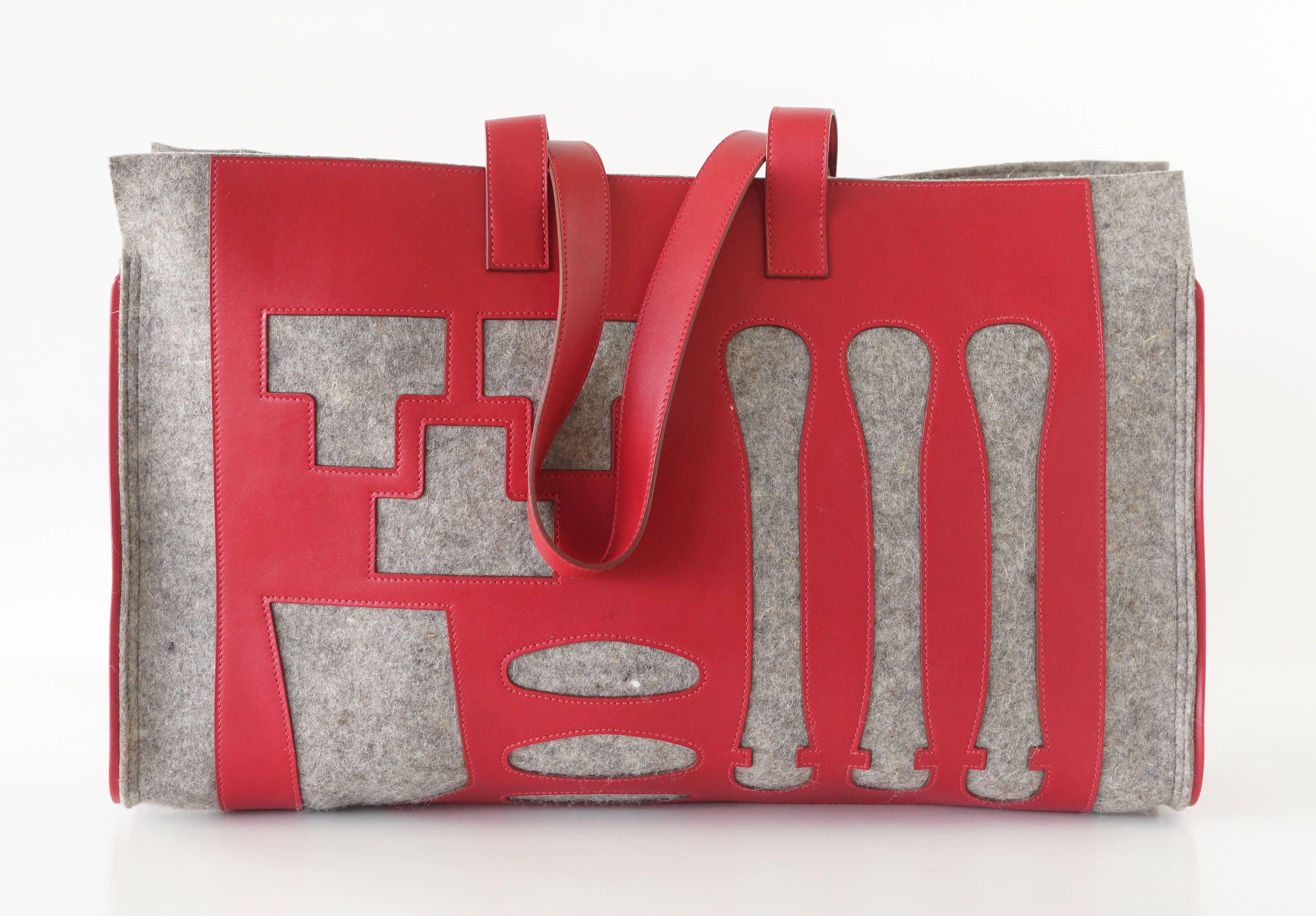 Limited Edition Petit h GM Skeleton grey natural felt and red swift leather tote.
The red leather is the cut out of a birkin.
A super coveted tote.
Interior signature leather plaque.
Utterly FABULOUS!
Has some natural markings.  
Comes with