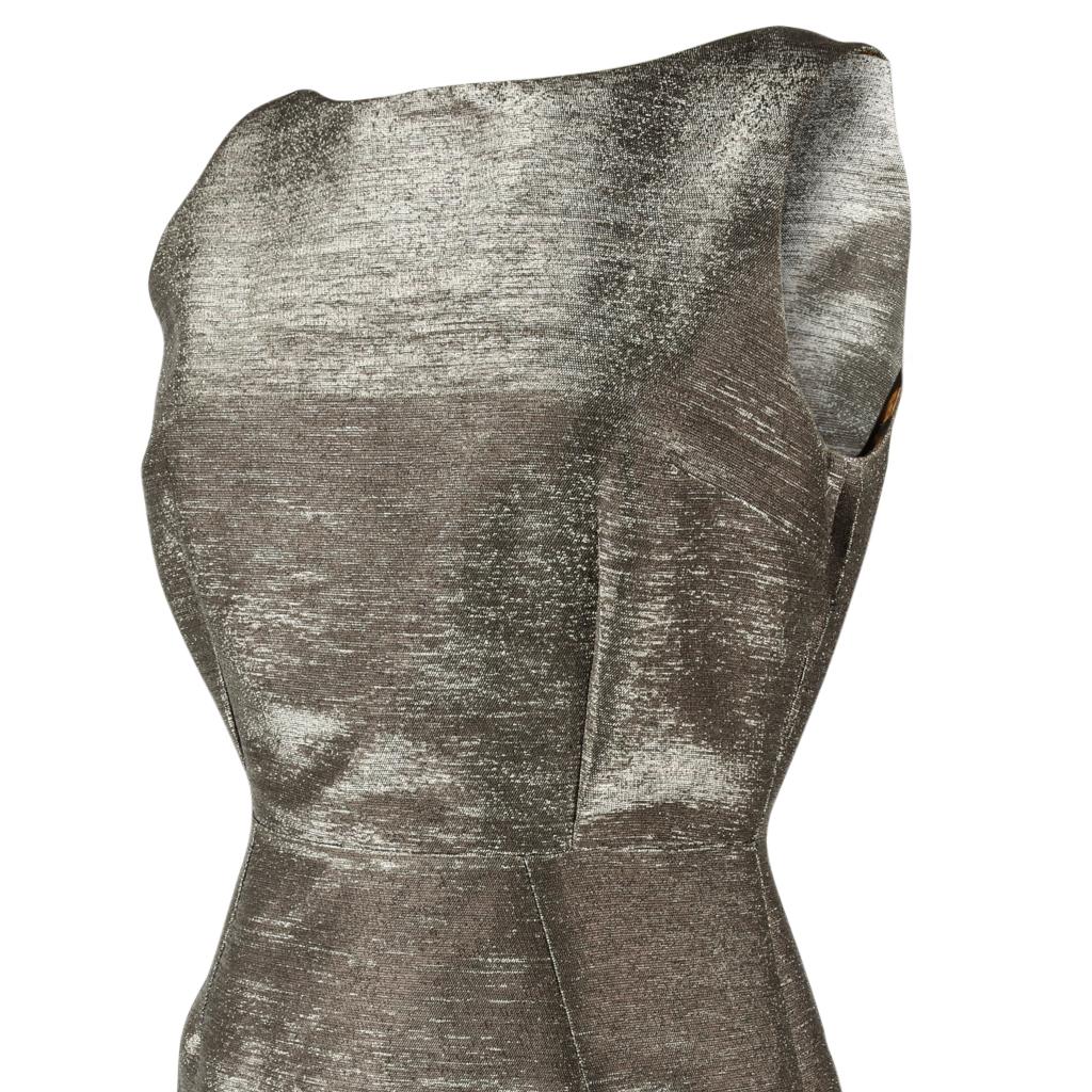 Dolce&Gabbana rare dress that was sold out in the stores. 
This treasure was worn one time only.
Silver gray fabric with fabulous texture and a metallic finish.
Front has a boat neck styling, and the rear dips into a fairly deep V.  
The rear zipper