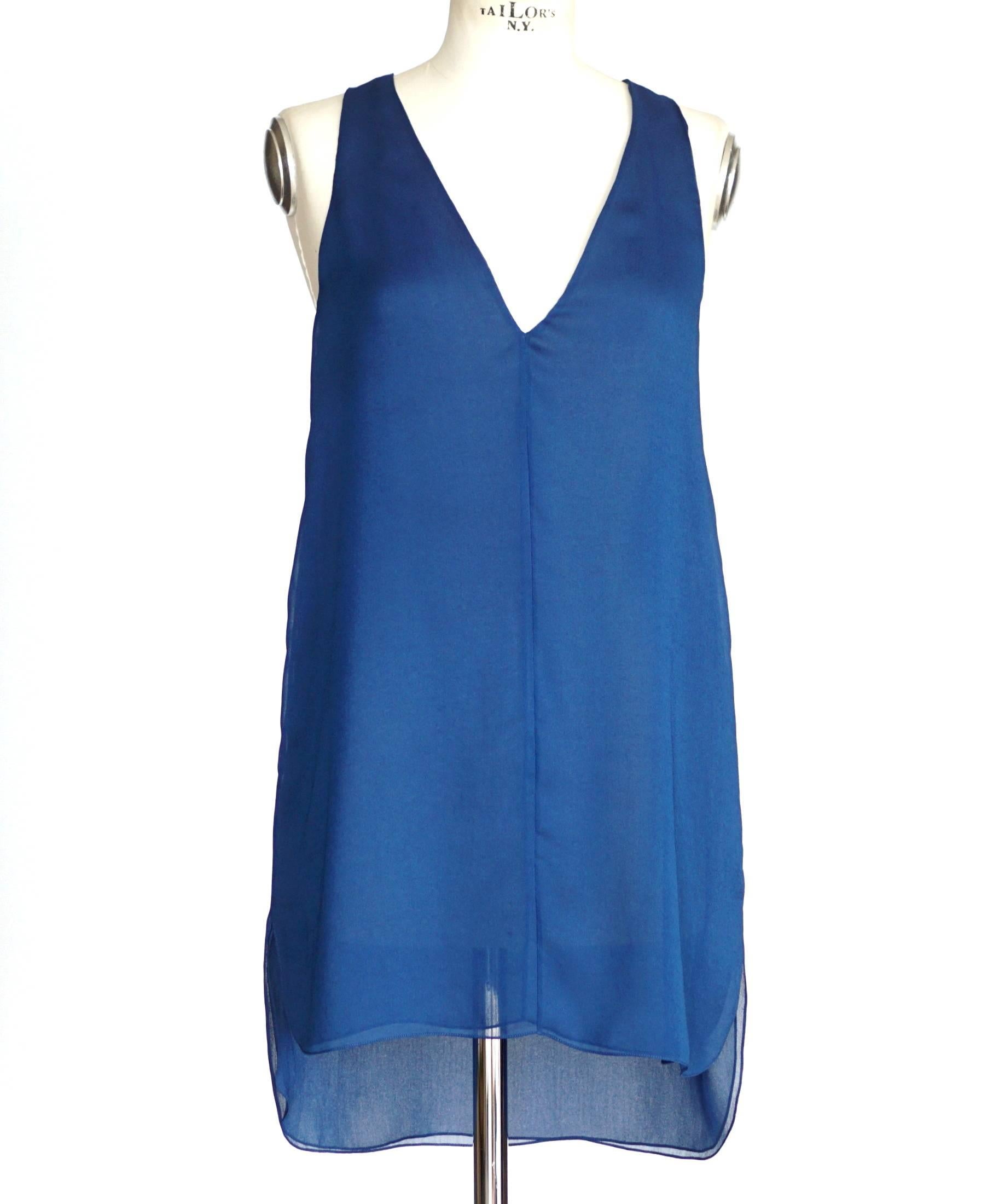 Guaranteed authentic CHLOE pant set in rich jewel toned tuareg blue.
Flowing deep V neck sleeveless tunic slightly longer at rear.
Tunic is semi sheer double layered.
Flat front pant with tapered leg.
Pant has 2 slot pockets at rear.
Fabric is
