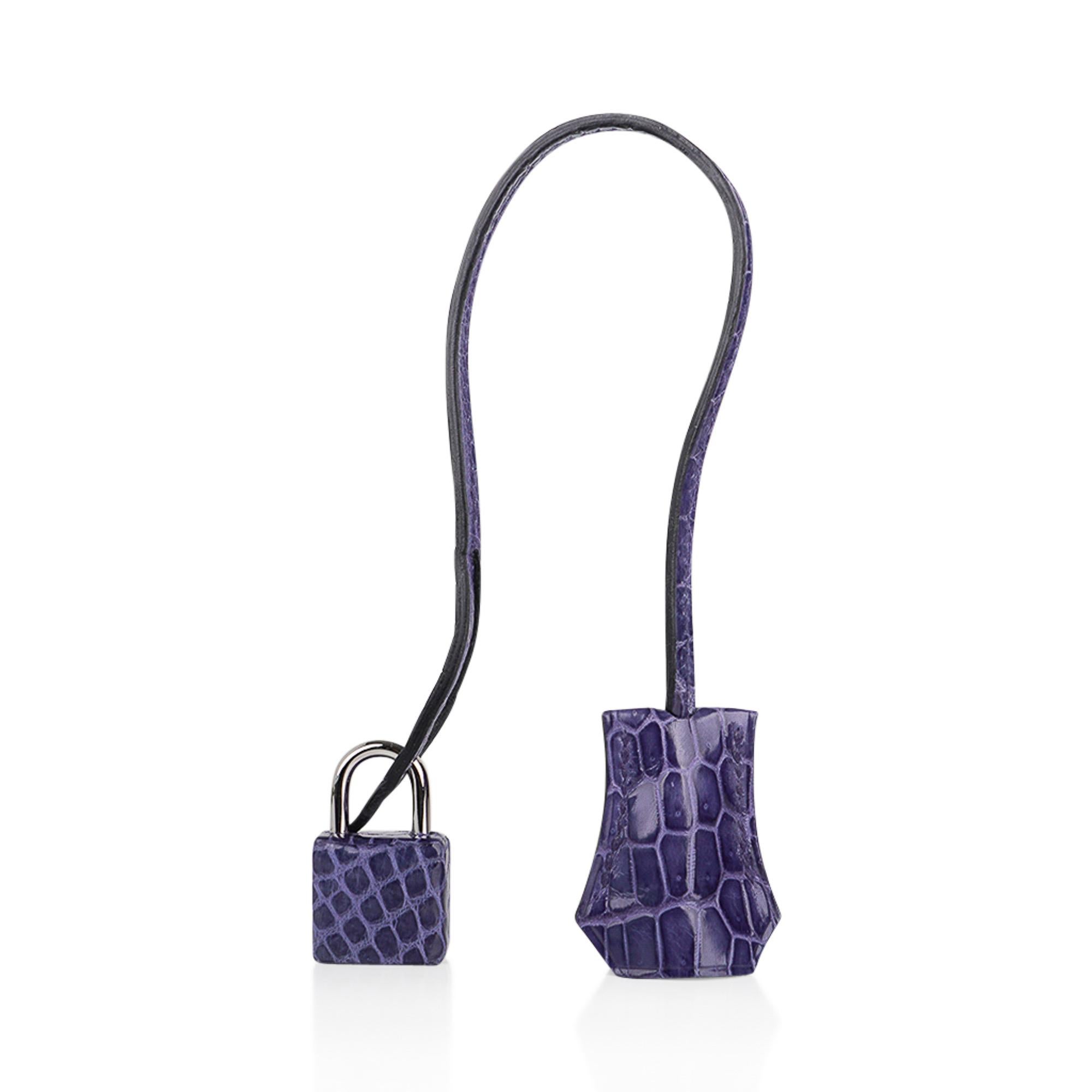 Mightychic offers a guaranteed authentic Hermes Birkin 35 bag featured in limited edition Blue Brighton Porosus Crocodile.
This Hermes crocodile Birkin bag blue has a lavender undertone and changes in different light.  Utterly extraordinary, this