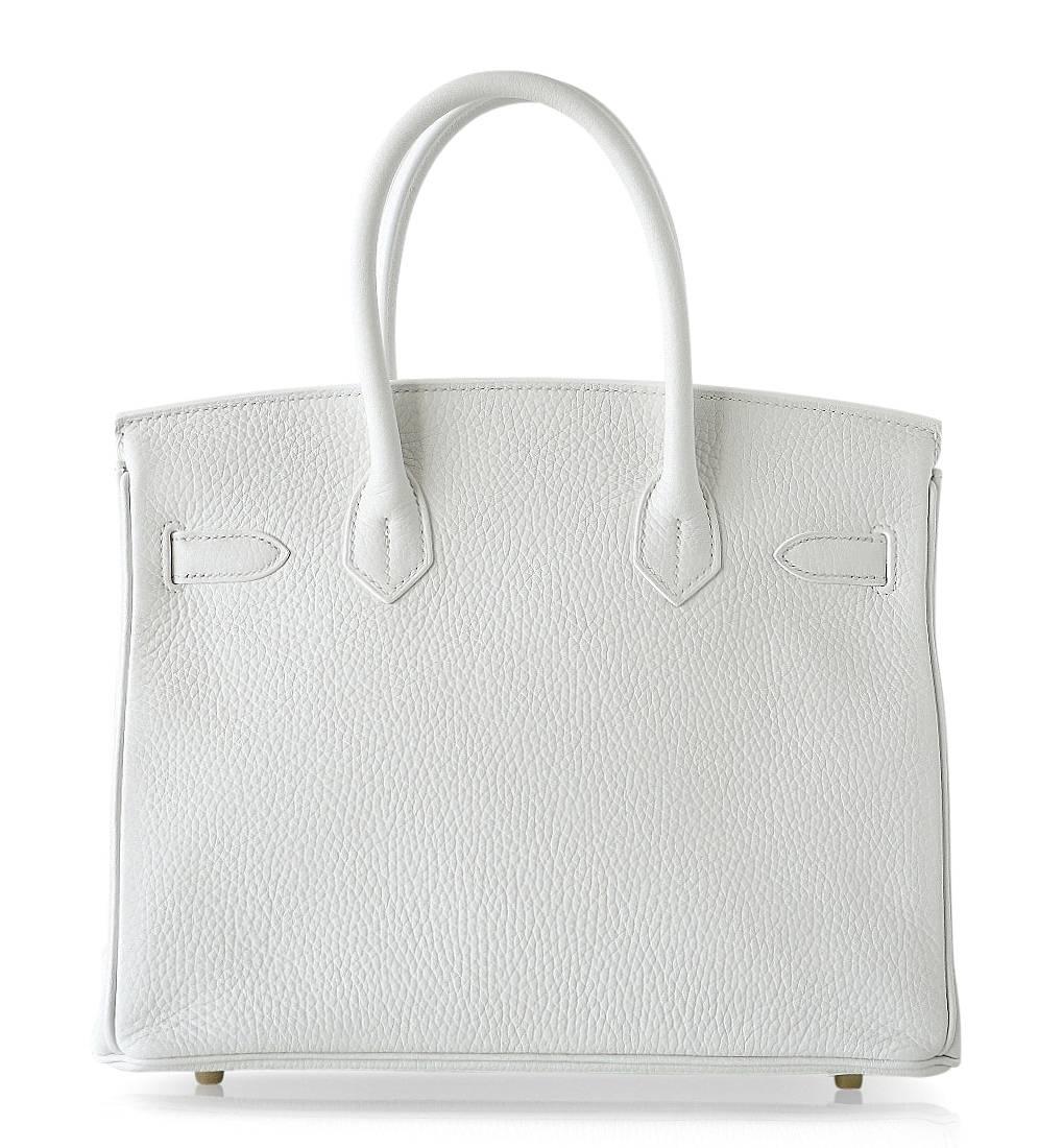 Fabulous snow White clemence leather Hermes Birkin 30.  
Retired colour, no longer produced. White is the most rare colour produced.
Fresh and rich with gold hardware.
NEW or NEVER WORN. 
Comes with the lock and keys in the clochette, sleepers,