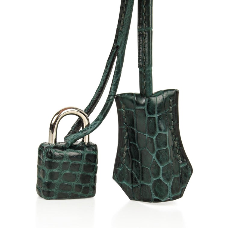 Phenomenal rich jewel toned green Hermes Birkin 40 bag Vert Fonce is chic and sophisticated in rare Matte Porosus crocodile.
This stunning bag is a great neutral.  
Palladium hardware.   
NEW or  NEVER WORN.
Comes with lock, keys, clochette,