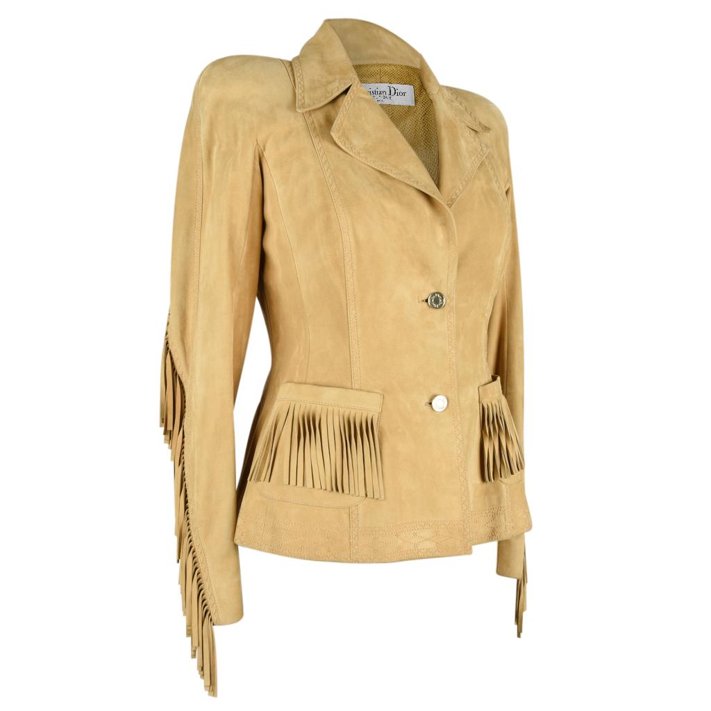 Mightychic offers a Christian Dior incredibly soft chamois coloured Chevre (goat) suede.
2 Button single breast shaped jacket.
Lush suede fringe on the upper rear, down the arms, and on the 2 pockets.  The effect is fantastic!
Small, shaped shoulder