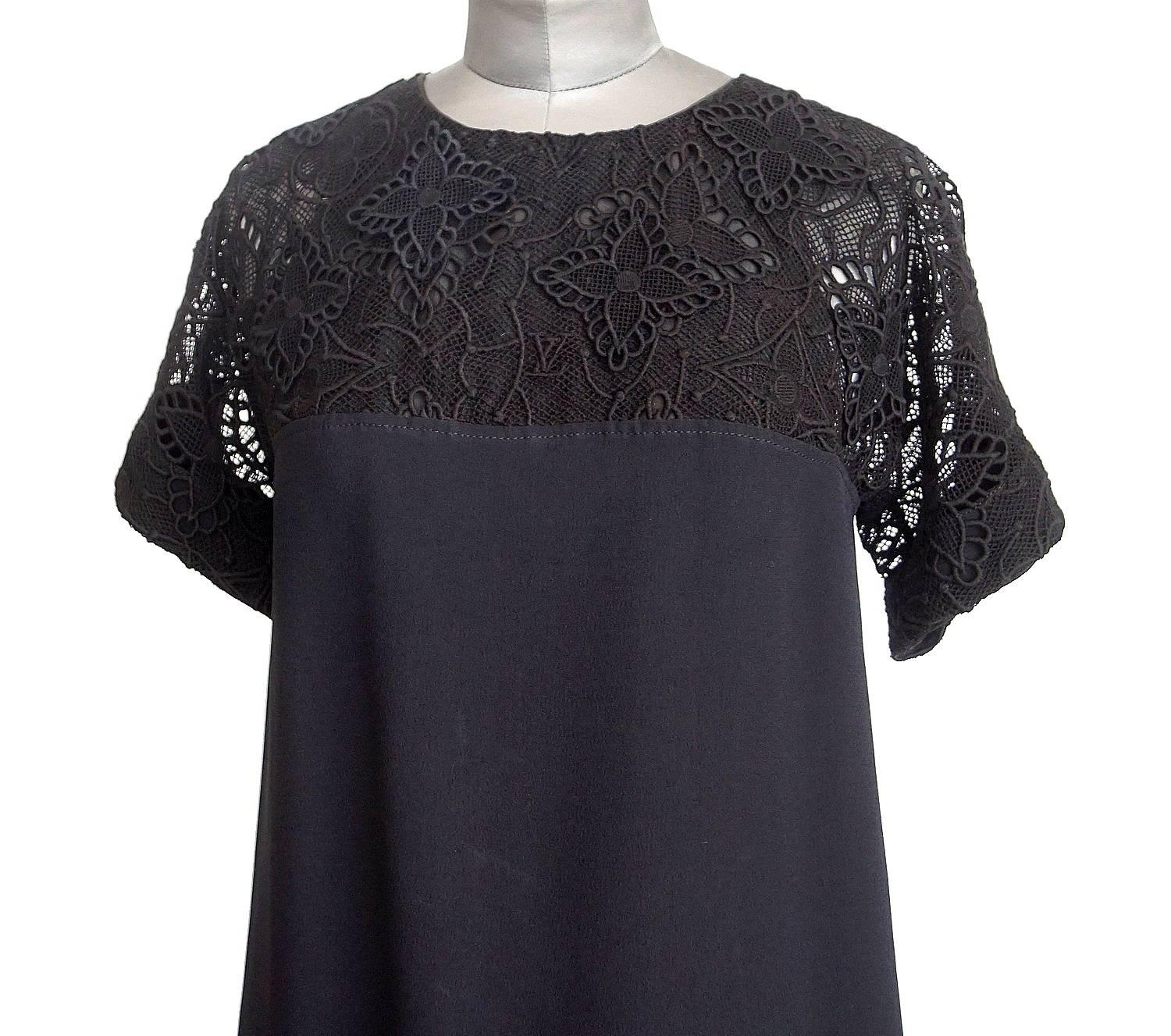 Chic Louis Vuitton dress with beautifully detailed Monogram lace from neckline to top of bust and sleeve.
Dress has a subtle A-line.
Bold gold zip with embossed pull at rear.
Embroidery is cotton, rest is acetate and viscose and lining is silk.
NEW