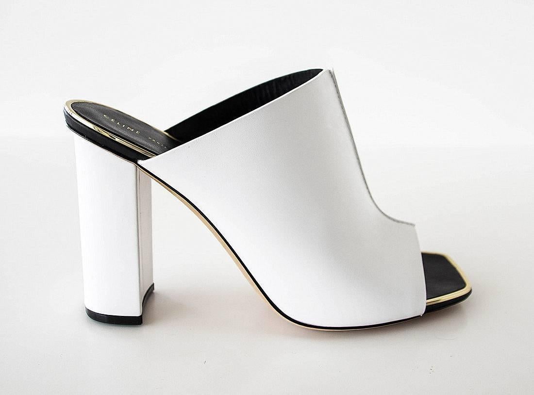 Guaranteed authentic Celine sleek white leather mule with raised seam detail.
Gold metal accent edging.
Front top stitch. 
Covered chunky block heel.
Modern and fresh.
Comes with box and sleeper.
Worn once indoors.
final sale
 
SIZE 39
USA SIZE