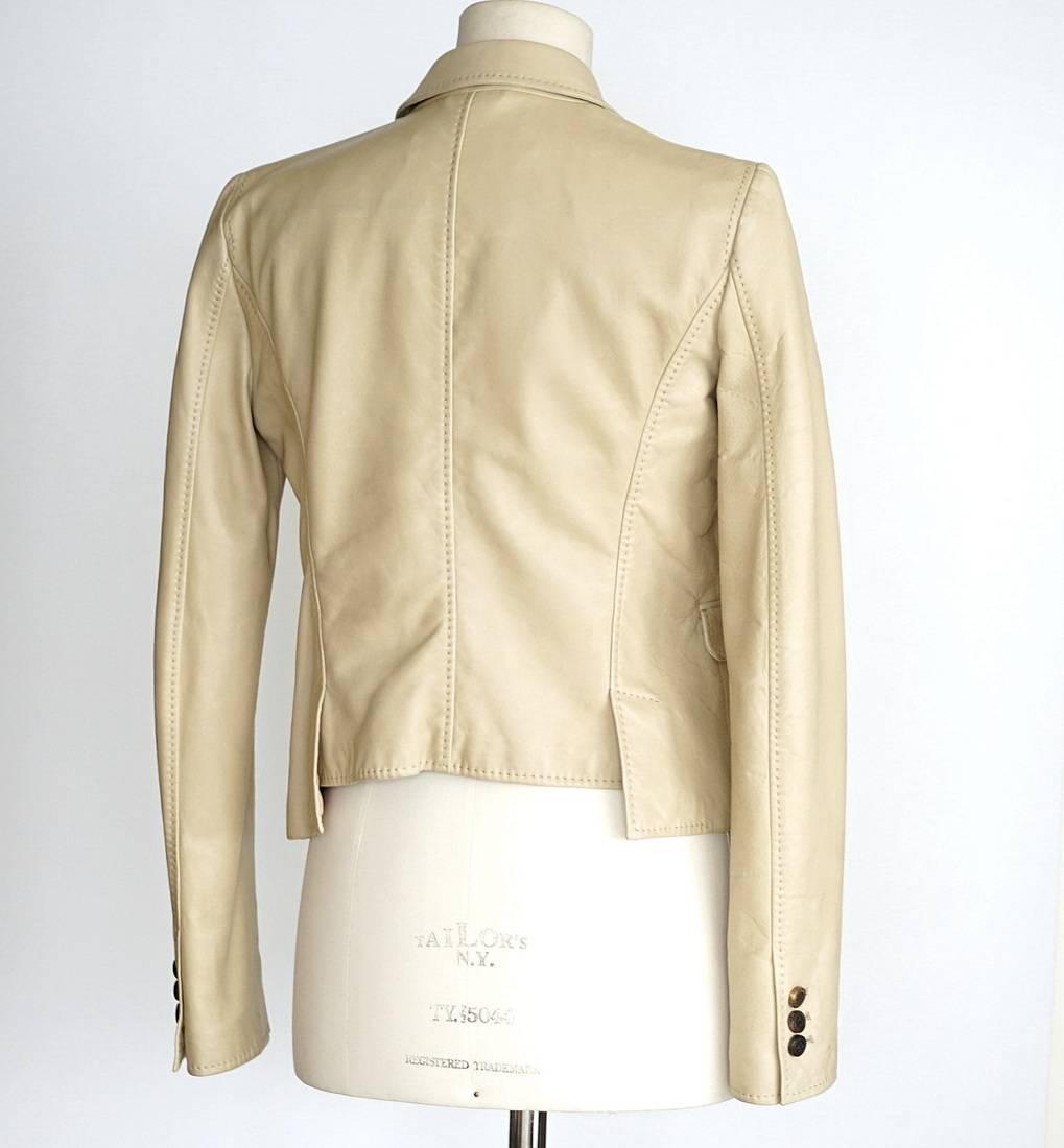 
Guaranteed authentic DSQUARED2 nude lambskin jacket. 
Buttery soft single breast lambskin jacket with 4 flap pockets.
Rear design detail.
1 embossed front button and 3 working buttons on each cuff.
Top stitch throughout.
Fabric is
