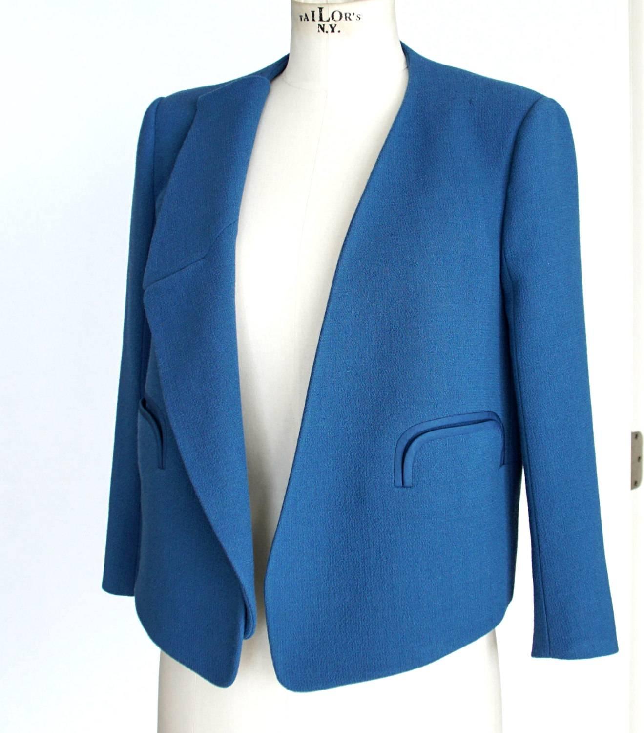 Guaranteed authentic CHLOE versatile blue jacket.
Beautifully cut Santorini blue wool open jacket. 
Fabulous neutral for a pop of colour!
Detachable lapels convert jacket to a V-Neck style.
2 stylized slot pockets.
Jacket is partially lined.
Fabric