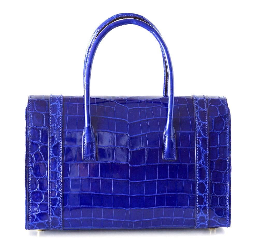 One of the most elegant bags HERMES ever produced! 
Just brought out of retirement in a limited quantity.  
Electric Blue niloticus crocodile with gold hardware - Uber Rare! 
Simply exquisite and chic.  
NEW or NEVER WORN  
Comes with the lock and