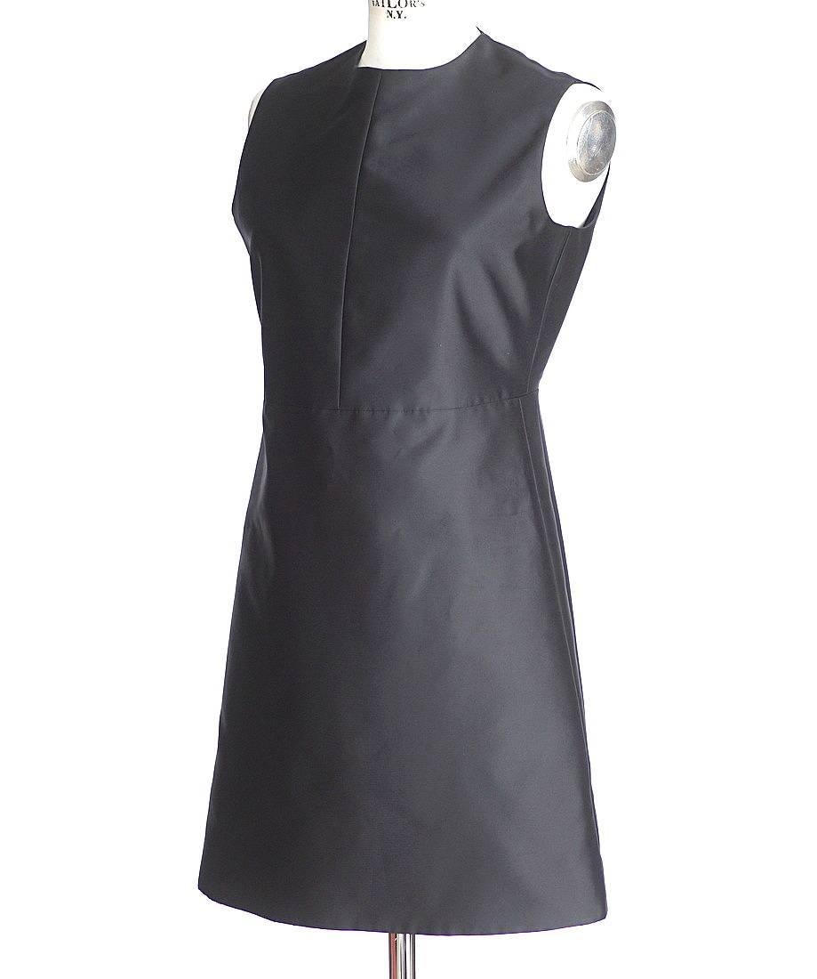 Guaranteed authentic Celine black sleeveless sheath beautiful in its simplicity.
Stitch detail on bodice and waist and the length of the sides.
Jewel neckline.
Hidden rear zipper.
Marvelous light weight.
Fabric is polyester and silk. 
Rear has a