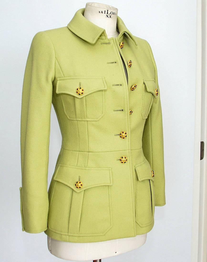Guaranteed authentic CHANEL 96A exquisitely shaped and detailed pale green jacket.
6 Button single breast with Cabochon jeweled buttons with CC center.
4 Safari influenced pockets with 1 button each.
Cuffs have a "tab" with 3 working