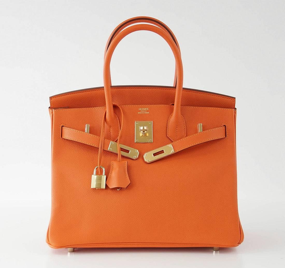 Guaranteed authentic Orange Feu (Fire) Hermes Birkin.
Lush with gold hardware. 
Epsom leather.
NEW or NEVER WORN. 
Comes with the lock and keys in the clochette, sleepers, raincoat signature Hermes box. 
more pictures available upon