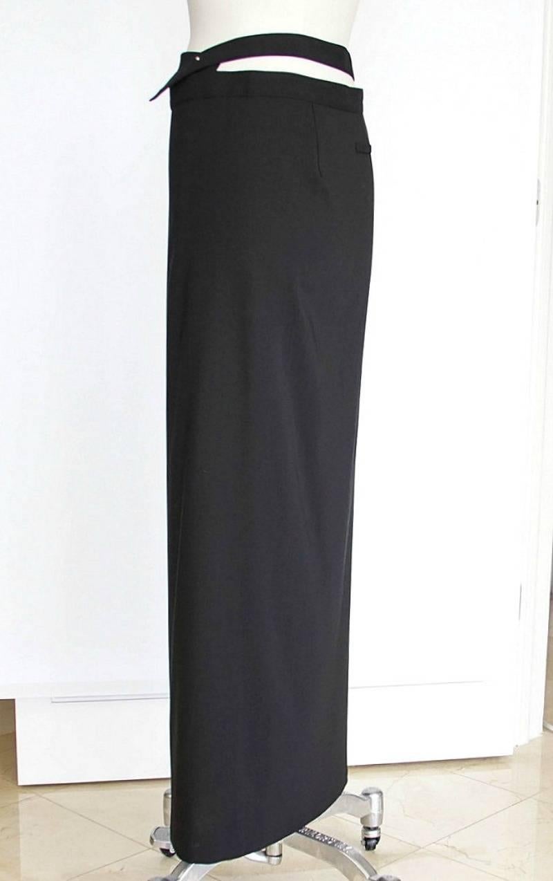 Mightychic offers a Jean Paul Gaultier 80s' vintage long wrap skirt with fabulous design detail.
Skirt 'belt' closes with silver hardware.
Beautiful wrap detail at waist reveals peek a boo skin.
Easy to dress up or down.
Fabric is wool and silk. 