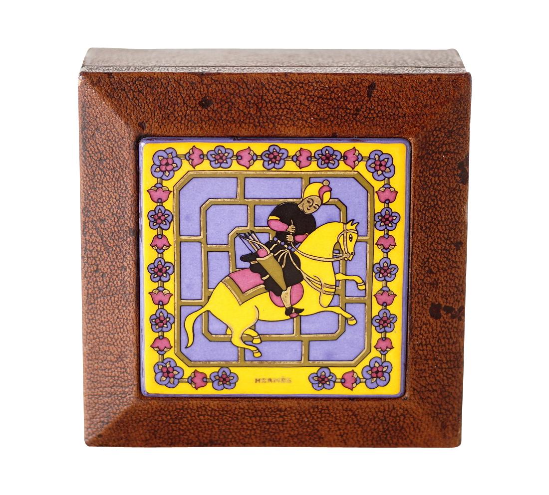 Guaranteed authentic rare beautiful Hermes brown textured leather box.
Enamel top depicts a Persian horseman in blue, marigold, black and raspberry.
Interior is rich raisin.
Signature HERMES is stamped on the enamel.
Hermes Paris Made in France is