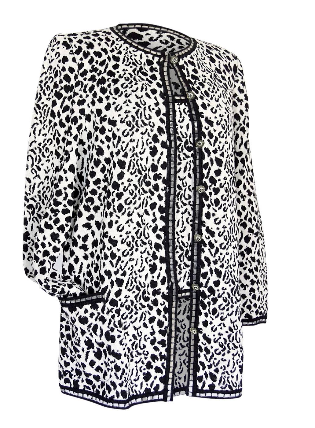 Guaranteed authentic Emanuel Ungaro timless classic sweater set in a wonderful black and white animal print with fabulous, delicate detailing!
Perfect Spring Summer weight.
The shell and cardigan are edged out in a lovely 3/4
