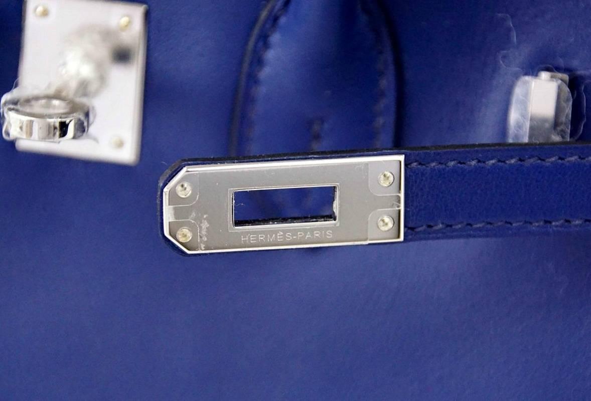 Guaranteed authentic Blue Sapphire is like wearing a jewel! 
Perfect neutral without giving up a pop of colour.
Fresh Palladium hardware.
Lush swift leather.
Comes with lock, keys, clochette, sleepers, raincoat and signature Hermes box.
NEW or NEVER