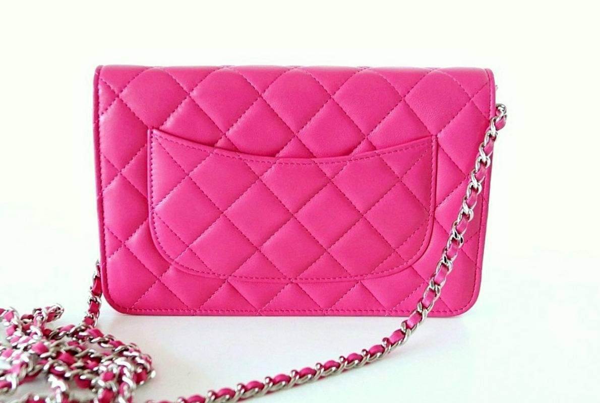 Hard to find fabulous Chanel pink lambskin wallet on chain.
Silver hardware.
Zip pocket under flap.
This piece can be carried as shoulder or cross body.
1 compartment, 2 slot pockets and zip pocket.
6 credit card slots.
Signature Chanel stamp inside