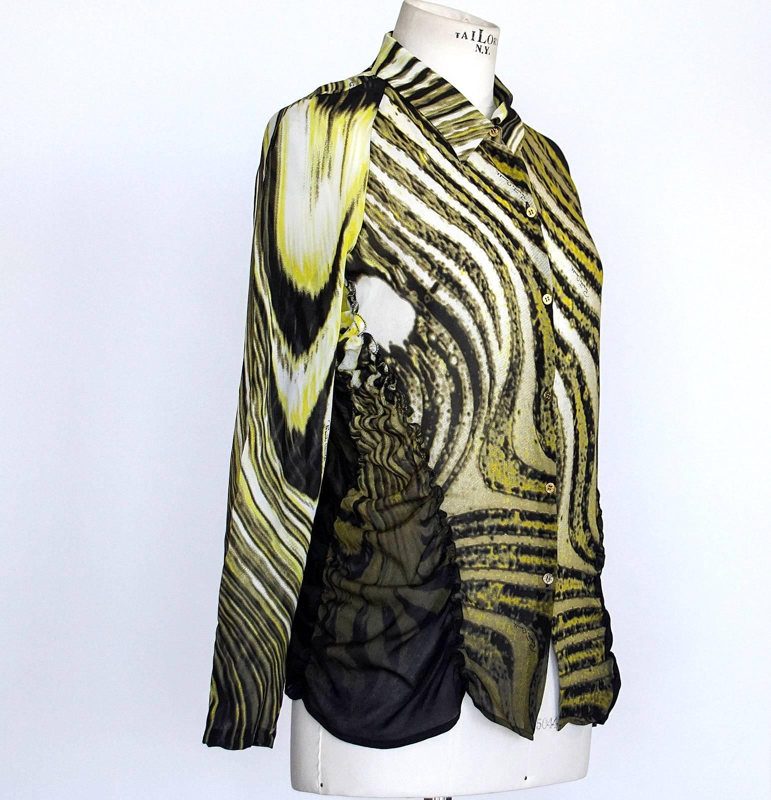 Guaranteed authentic Roberto Cavalli  top in a timeless abstract print. 
Print is a beautiful lemony yellow fading into winter white and black.
6 gold embossed buttons.
Left sleeve is black, right is print.
The sides are shirred and edged with a