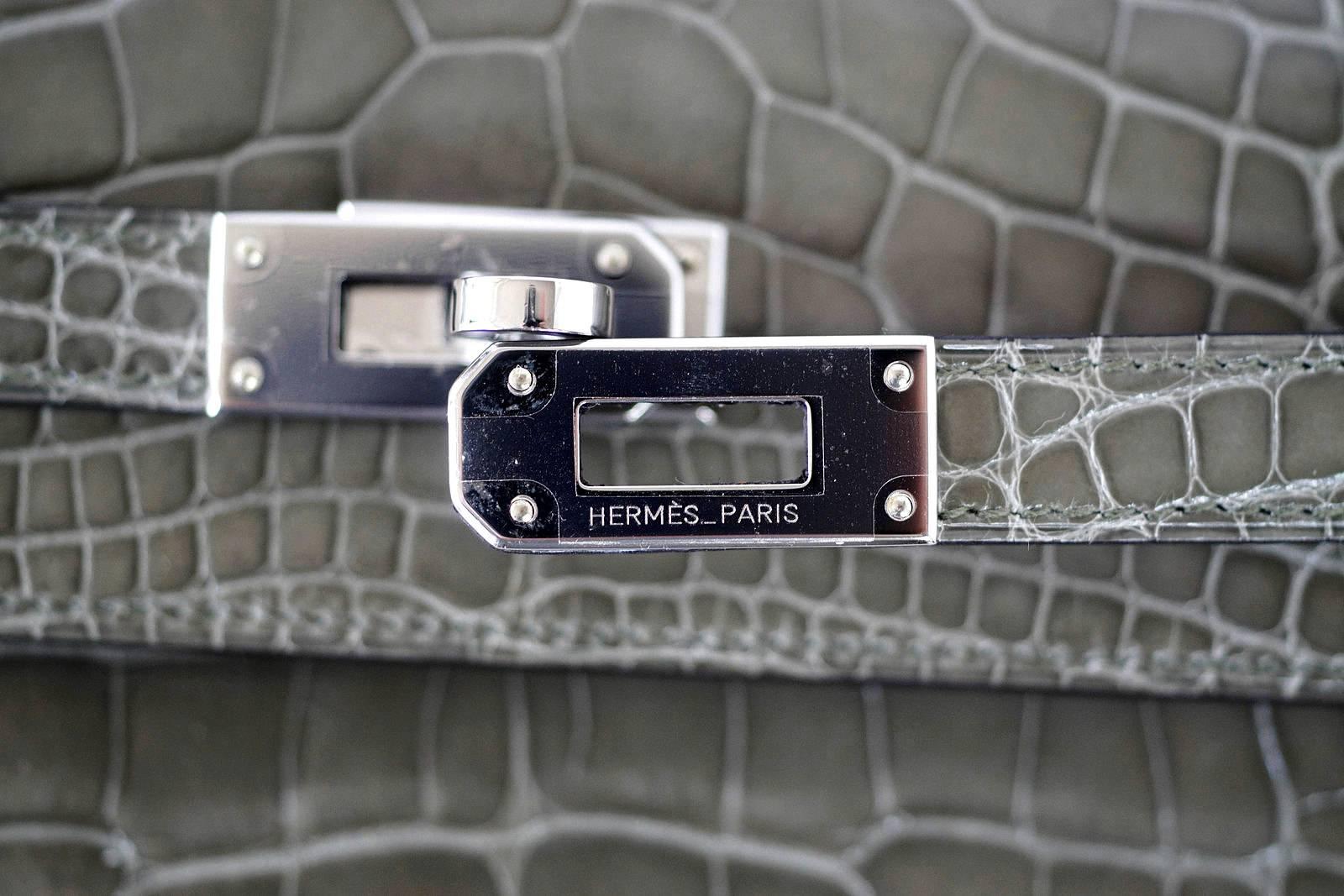 Guaranteed authentic extraordinarily beautiful Hermes Kelly Long wallet in coveted Gris Tourterelle Alligator.
This beauty is extremely rare and the colour is retired.
Often carried as a clutch.
Signature lock interior zipper pull.
Stamped HERMES