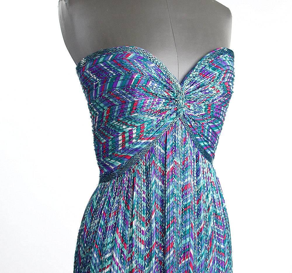 Guaranteed authentic BOB MACKIE gorgeous gown in cool blues, pink, purple. 
Same style worn by Linda Hamilton on the Red Carpet
Strapless sweetheart neckline with an empire bodice accentuated with beading.
Blue/green bugle beading throughout the