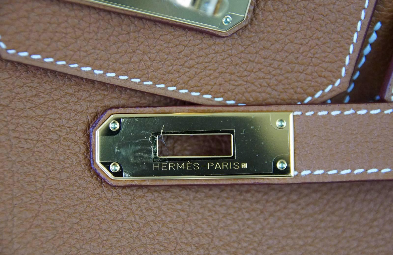 Guaranteed authentic coveted iconic Hermes Gold classic.
Rich with Gold hardware in scratch resistant Togo.  
NEW or NEVER WORN. 
Comes with the lock and keys in the clochette, sleepers, raincoat signature Hermes box. 
final sale

BAG