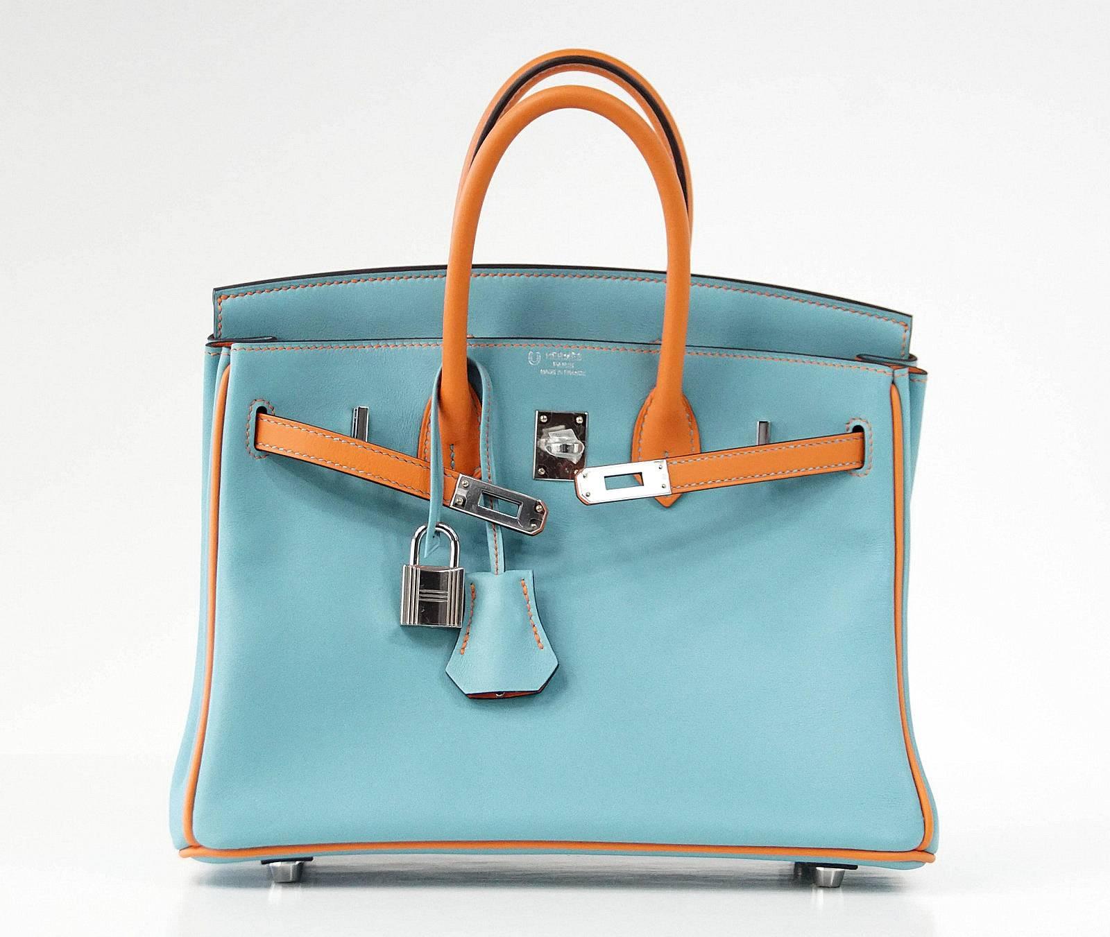 Guaranteed authentic Bleu Saint Cyr and Feu pop of color in swift leather.
Fresh with Palladium hardware. 
Comes with lock, keys, clochette, sleepers, raincoat and signature Hermes box.
NEW or NEVER WORN.
final sale

BAG MEASURES:
LENGTH  25cm /