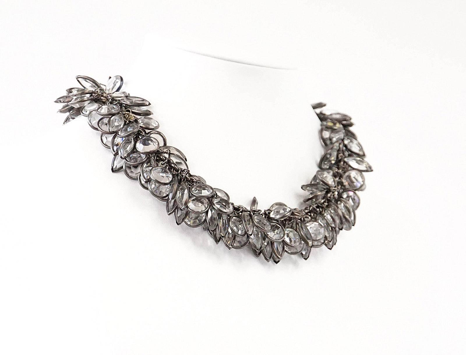 Guaranteed authentic utterly sensational Deco inspired vintage choker necklace.
Heaps of faceted clear 'crystals' set on a gunmetal chain link create this lush piece.
Each diamante is individually set to the chain link and is edged in the gunmetal