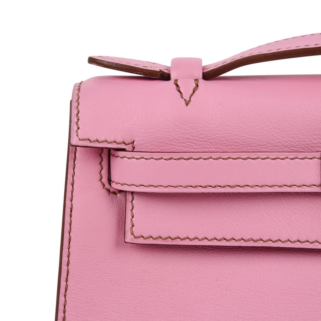 pink hermès kelly clutch