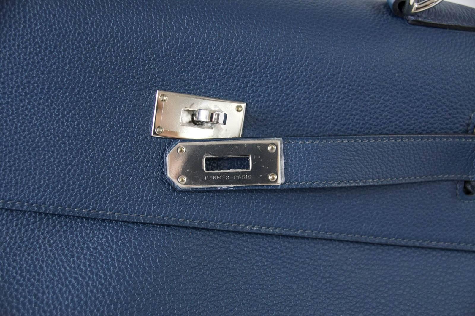 Guaranteed authentic Hermes Travel Kelly Voyage rich Blue de Prusse togo leather.
Fresh with Palladium hardware. 
Carried one time only.  Plastic on hardware.
Comes with lock, keys and sleeper.  
final sale

BAG MEASURES:
LENGTH  50cm / 19 5/8