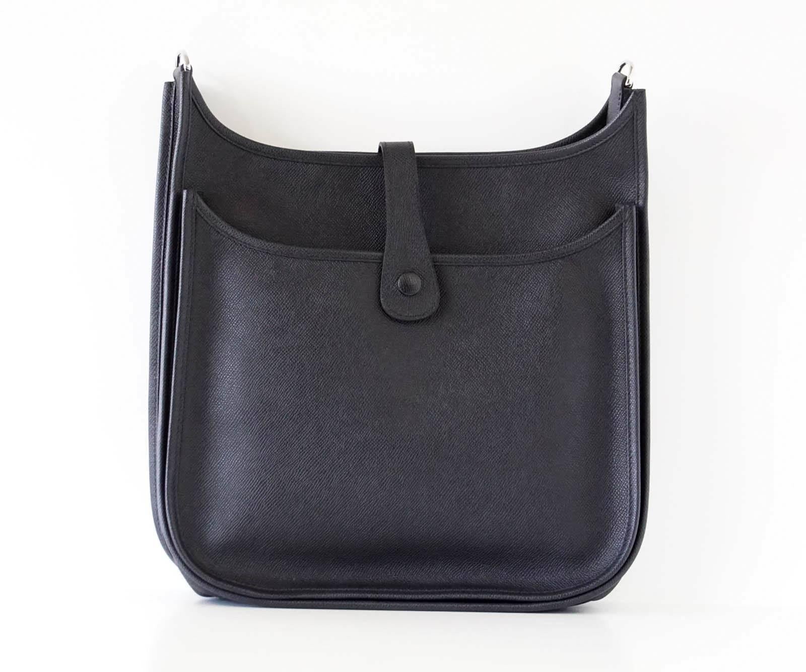 Guaranteed authentic Hermes Black EVELYNE lll GM in supple soft Epsom Soupple. 
Shoulder or cross body bag with roomy interior.
Rear outside deep pocket with snap closure.
Sport strap in textile with leather and palladium hardware