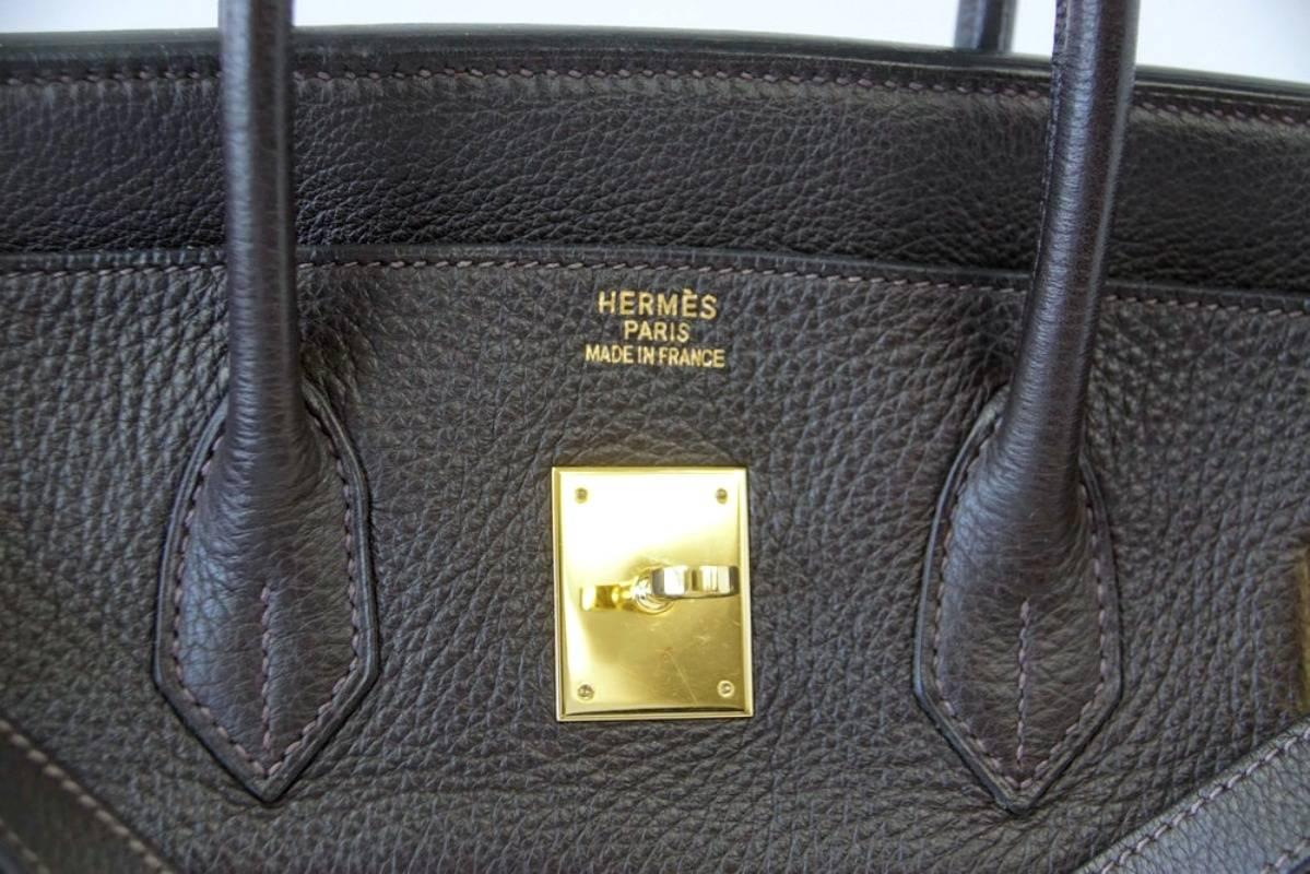 Guaranteed authentic Hermes coveted classic Toile in very rare Ebene Clemence leather.
Rich with gold hardware.
Corners, handles, body and interior are clean with no wear.
Hardware has wear marks. 
Comes with sleepers, lock, keys and clochette. 