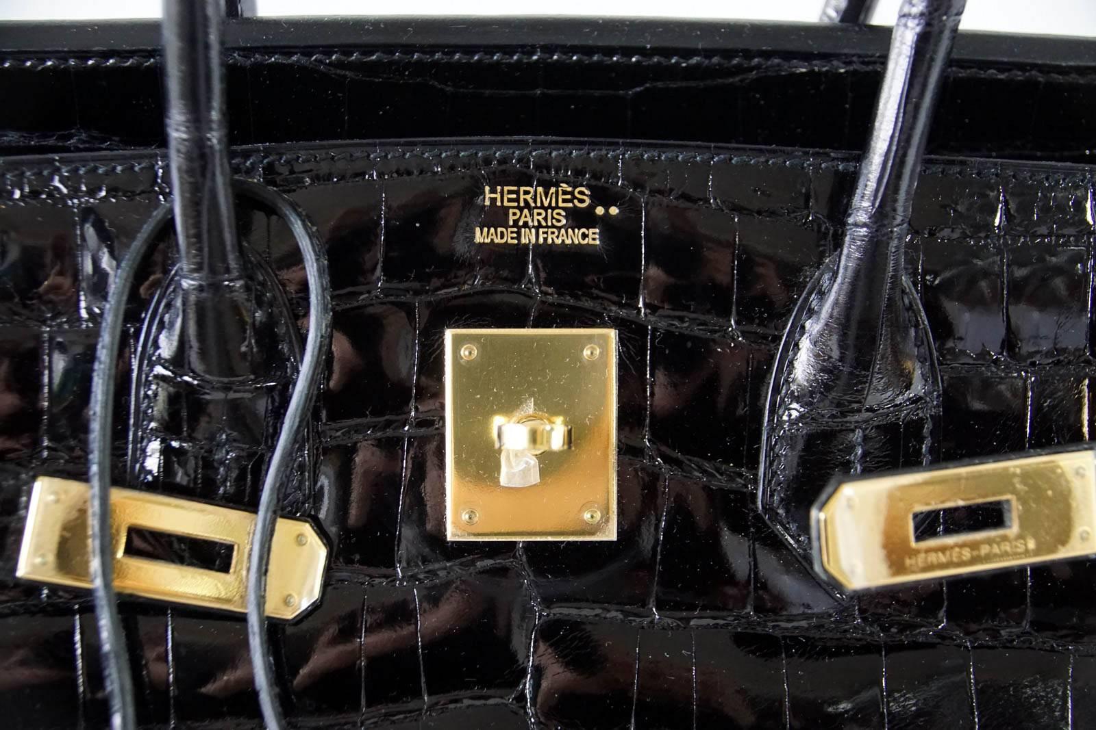 Guaranteed authentic coveted Hermes 35 Birkin bag Black Niloticus Crocodile.
This magnificent bag with Gold Hardware is breathtaking.
Comes with lock and keys in the clochette and sleeper.
Bag body, handles, and corners interior are mint. Plastic on