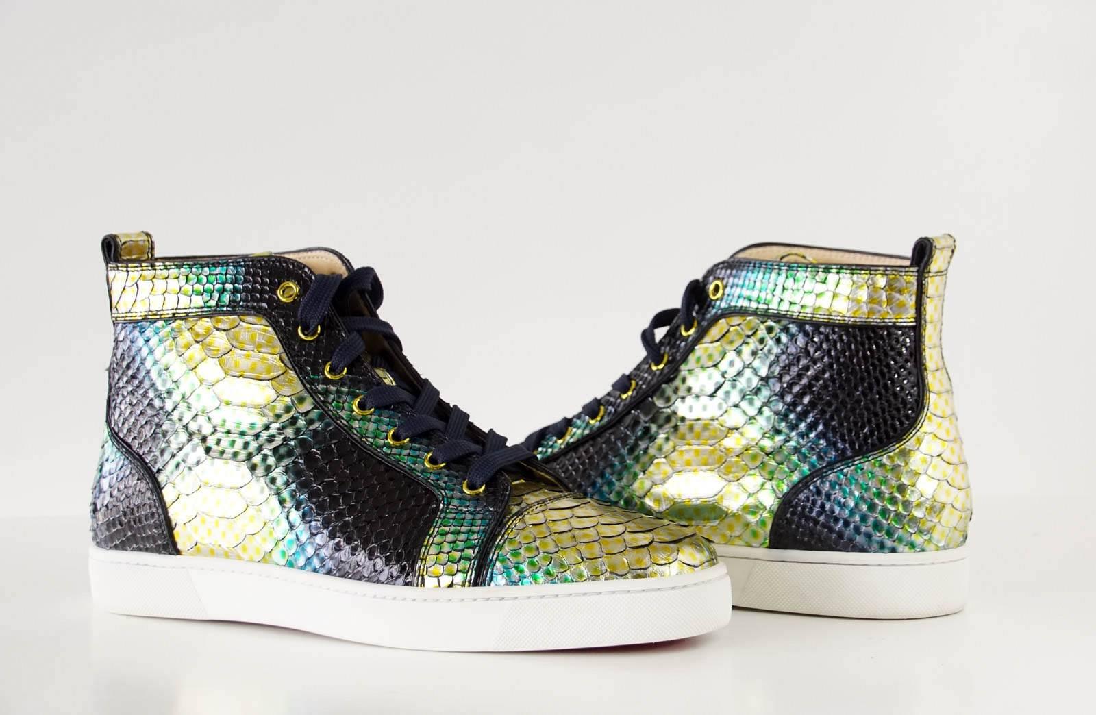 Guaranteed authentic CHRISTIAN LOUBOUTIN men's flat snakeskin sneaker.
Fabulous snakeskin mimosa aquarium in gold, green, blue and black.
Logo plaque on side of shoe.
Comes with box and sleeper.
NEW or NEVER WORN. 
final sale

SIZE 44.5
USA SIZE
