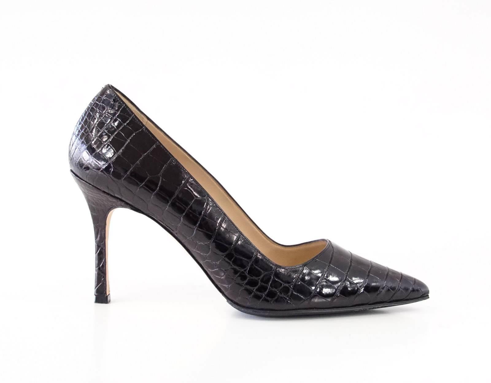 Guaranteed authentic MANOLO BLAHNIK matte alligator timeless pump.
Classic black alligator. 
Pointed toe and stiletto heel. 
Soles have already have protection put on.
Comes with sleeper.
NEW or NEVER WORN. 
final sale

SIZE 39
USA SIZE 9

SHOE