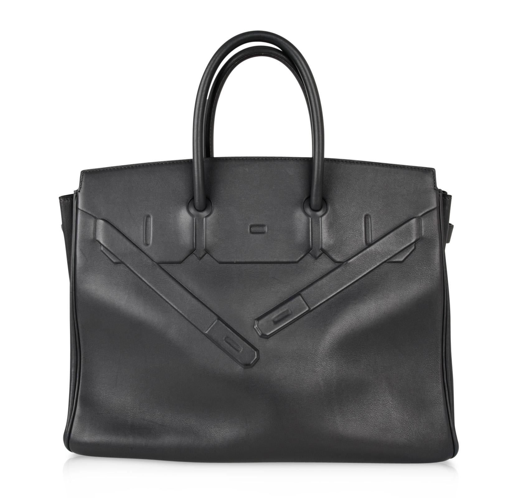 Guaranteed authentic coveted and extremely rare Limited Edition Hermes Ardoise Shadow Birkin bag in Evercalf Leather.
This beautiful bag conceived by Jean Paul Gaultier is the ultimate trompe l'oeil.
Produced only in 2009 this is a true Collectors