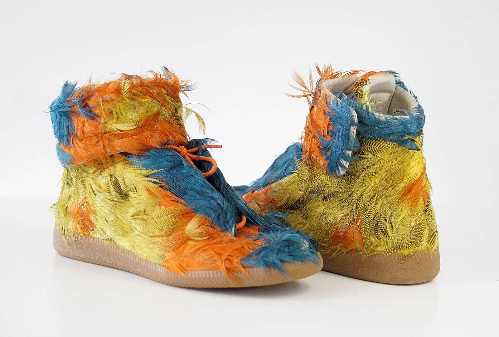 Guaranteed authentic Maison Martin Margiela men's Future Duck Feather High-Top sneaker. 
Dyed duck feathers adorns this shoe in beautiful multi colours. From Italy.
Lace up front with lace guards on the sides.
Velcro closure grip straps around