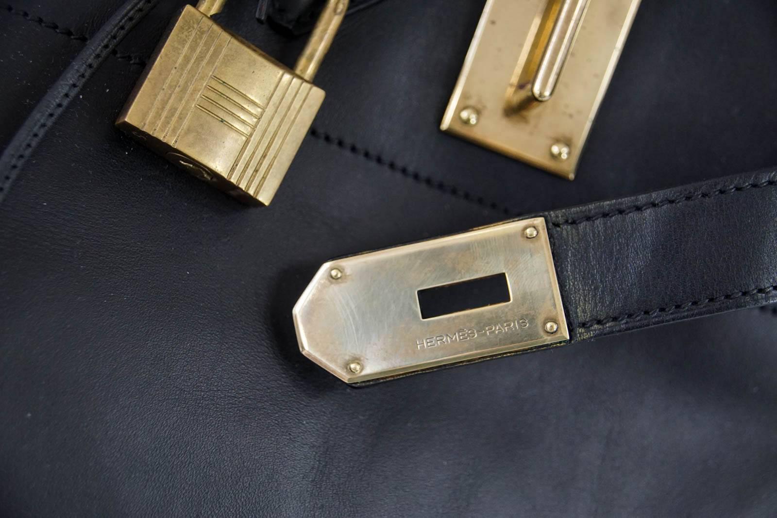 Guaranteed authentic uber rare Vintage 50 Hermes Hac in Black in rare Vache Noir leather.  
A striking combination with brass hardware.  
This beautiful bag is a true Hermes collectors treasure.
Very few natural wear marks
Comes with lock, keys and