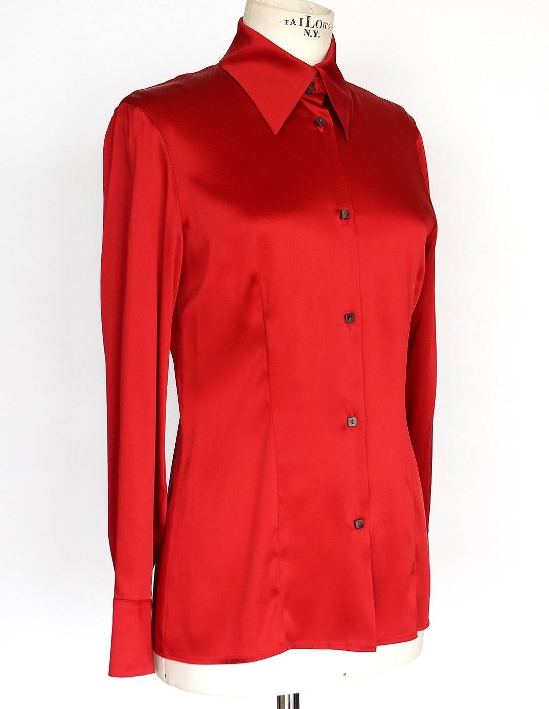 Guaranteed authentic GIANFRANCO FERRE beautiful red blouse. 
Beautiful and timeless Chinese red blouse.
7 small square buttons with 2 buttons at the collar.
Stitching detail gently shapes this blouse in front and back.
2 buttons on each cuff.
Fabric