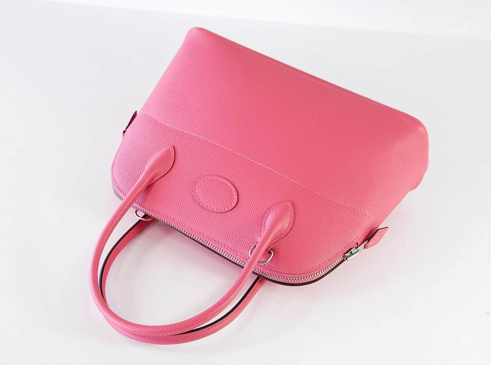 Beautiful and charming 27cm BOLIDE in rich Rose Azalee Epsom leather.
Palladium hardware.   
The shoulder strap adds versatility to the bag allowing for crossbody or shoulder carry.
The bag comes with strap, box, sleeper, and raincoat.
NEW or NEVER