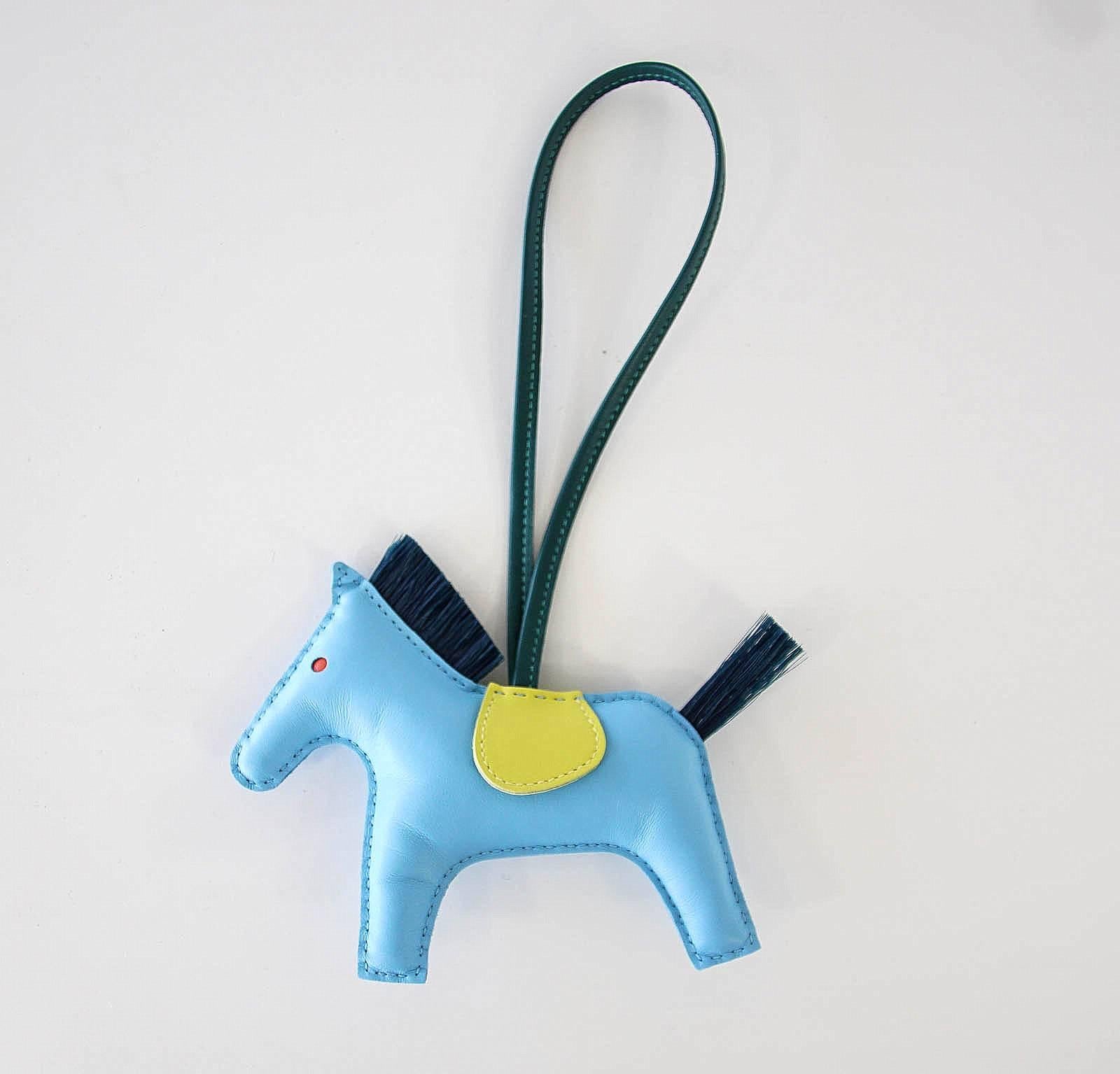 Guaranteed authentic HERMES Limited Edition Rodeo MM horse bag charm with genuine horsehair tail and mane
Body is Blue Celeste with Lime saddle and Malachite tail and mane.
Skin is lamb Milo.  
Signature HERMES PARIS MADE IN FRANCE is stamped under
