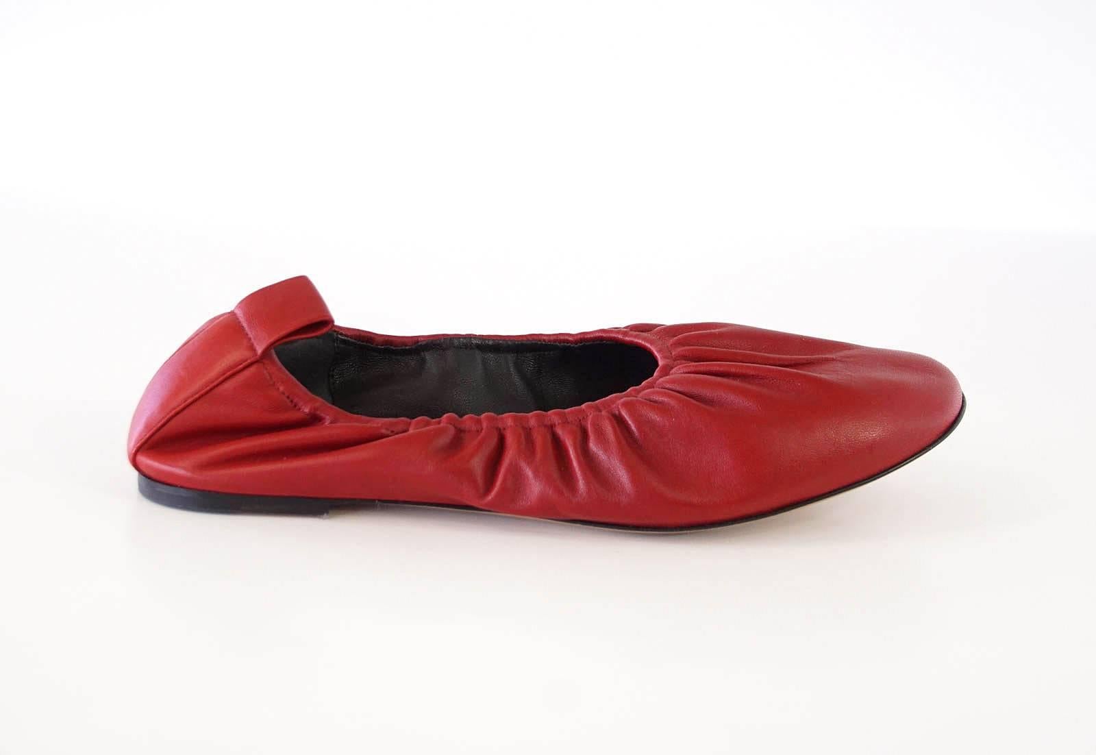 Guaranteed authentic CELINE chic red ballet flat in buttery soft red leather.
Higher cut on foot creates an updated, modern ballet style flat.
Elastic around top of shoe softly gathers leather for a comfortable fit.
Leather tab at rear.

SIZE  39