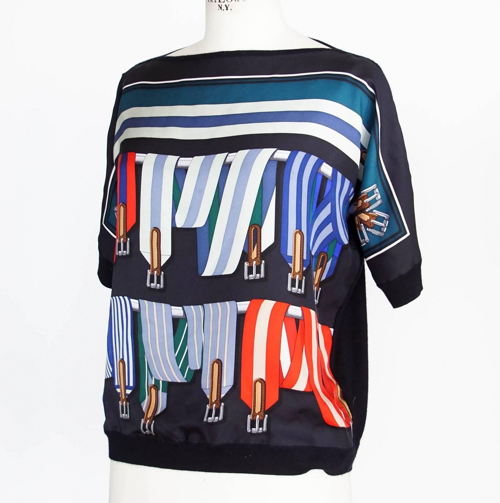 Guaranteed authentic HERMES rich printed silk top.  Easily unisex.
Braces motif silk print in colorful stripes.
The rear is a fine cashmere in dark navy.
Boat neck collar with ribbing around short sleeves and bottom.
Fabric is silk cashmere.
Small
