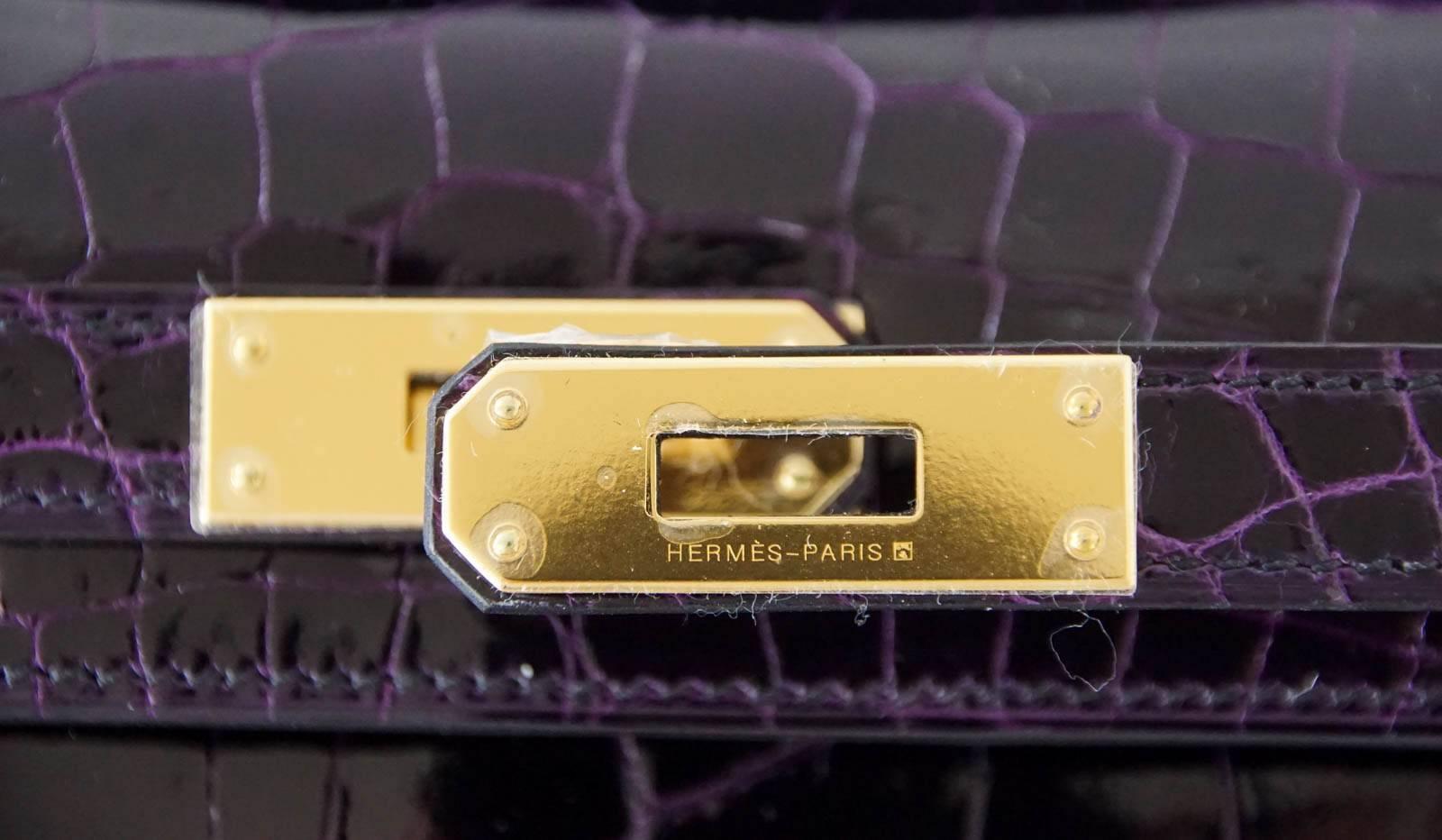 Guaranteed authentic timeless Hermes Kelly Cut in exotic jewel toned Aubergine. (Eggplant). 
Lush with gold hardware.
Comes with sleeper, signature Hermes box and ribbon.    
NEW or  NEVER WORN. 
final sale

BAG MEASURES:
LENGTH  12.25