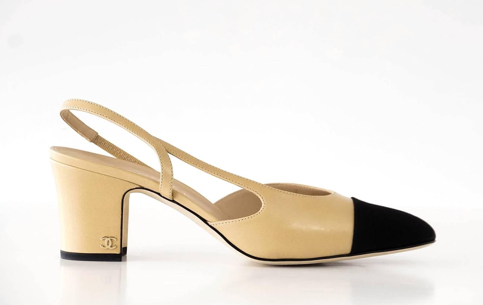 Guaranteed authentic CHANEL Mademoiselle camel and black classic.
The iconic classic leather slingback shoe in camel with black grosgrain cap toe.
65 mm block heel with signature gold CC logo. 
Comes with original Chanel box and sleepers.
See the