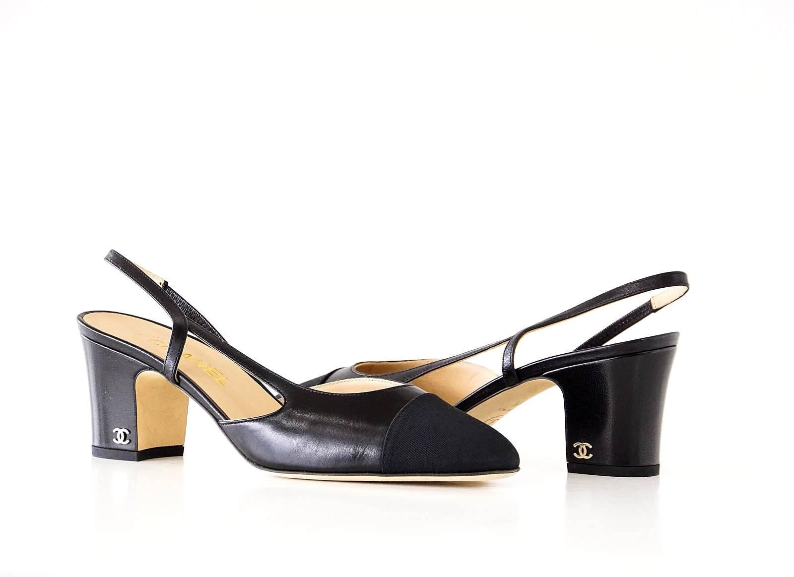 Guaranteed authentic CHANEL Mademoiselle black on black slingback shoe.
The iconic classic leather slingback shoe in black leather with black grosgrain cap toe.
65 mm block heel with signature gold CC logo. 
Comes with original Chanel box and