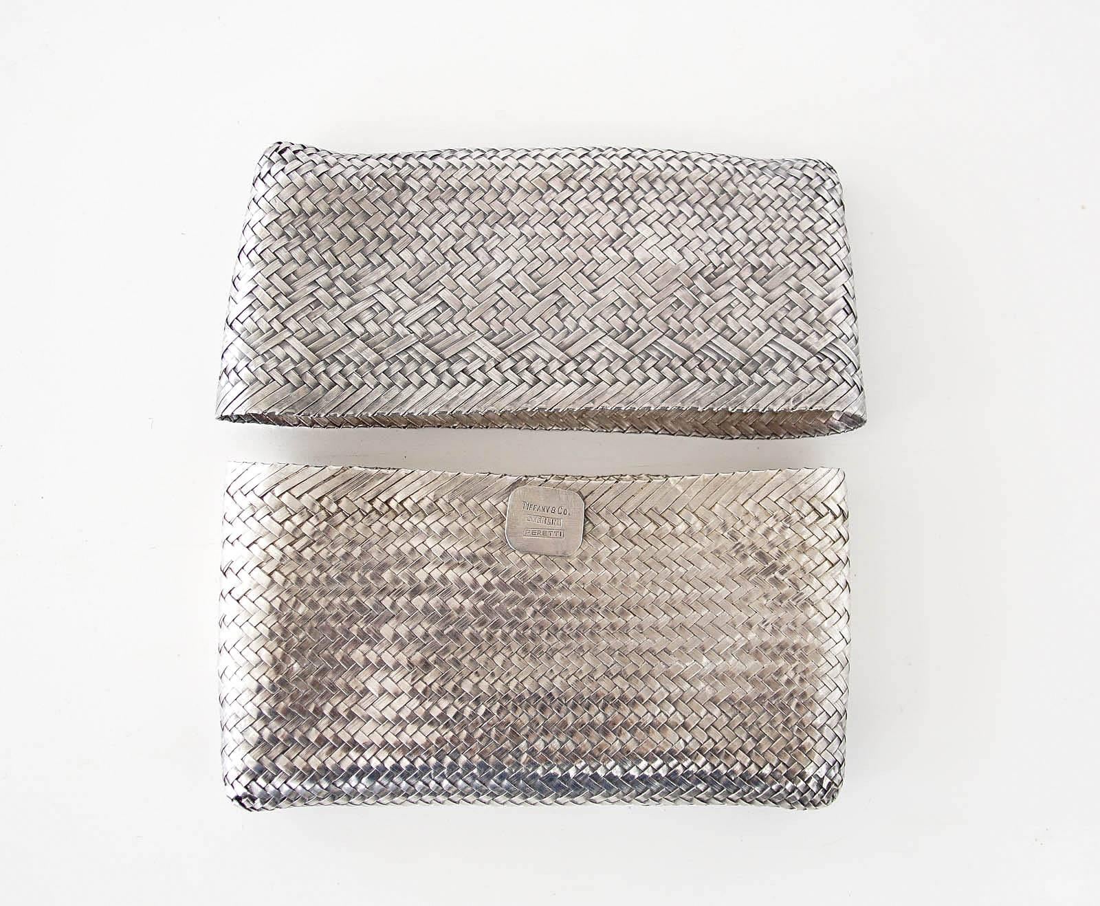 silver woven clutch