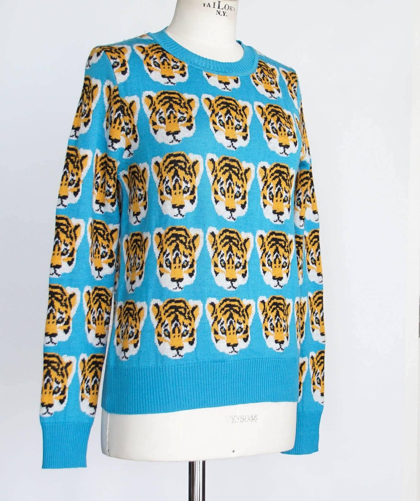 Guaranteed authentic LIBERTINE crewneck pullover sweater with tiger faces through out.
Blue background with charming baby tigers in orange, black, and white.
Ribbed neck, cuffs and bottom.
Fabric is cashmere and silk.
2 small marks on rear - see