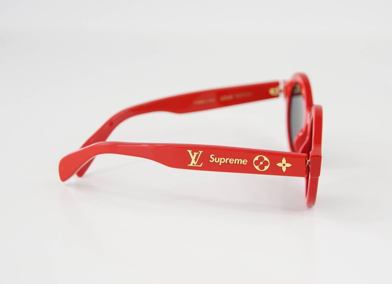 The highly coveted and sought after LOUIS VUITTON X SUPREME Very Limited Edition Red Downtown Sunglasses.
Supreme and Monogram gold embossed.
LV engraved on lens.
Comes with LV gift box, case, microfiber bag and booklet.
NEW or NEVER WORN
See