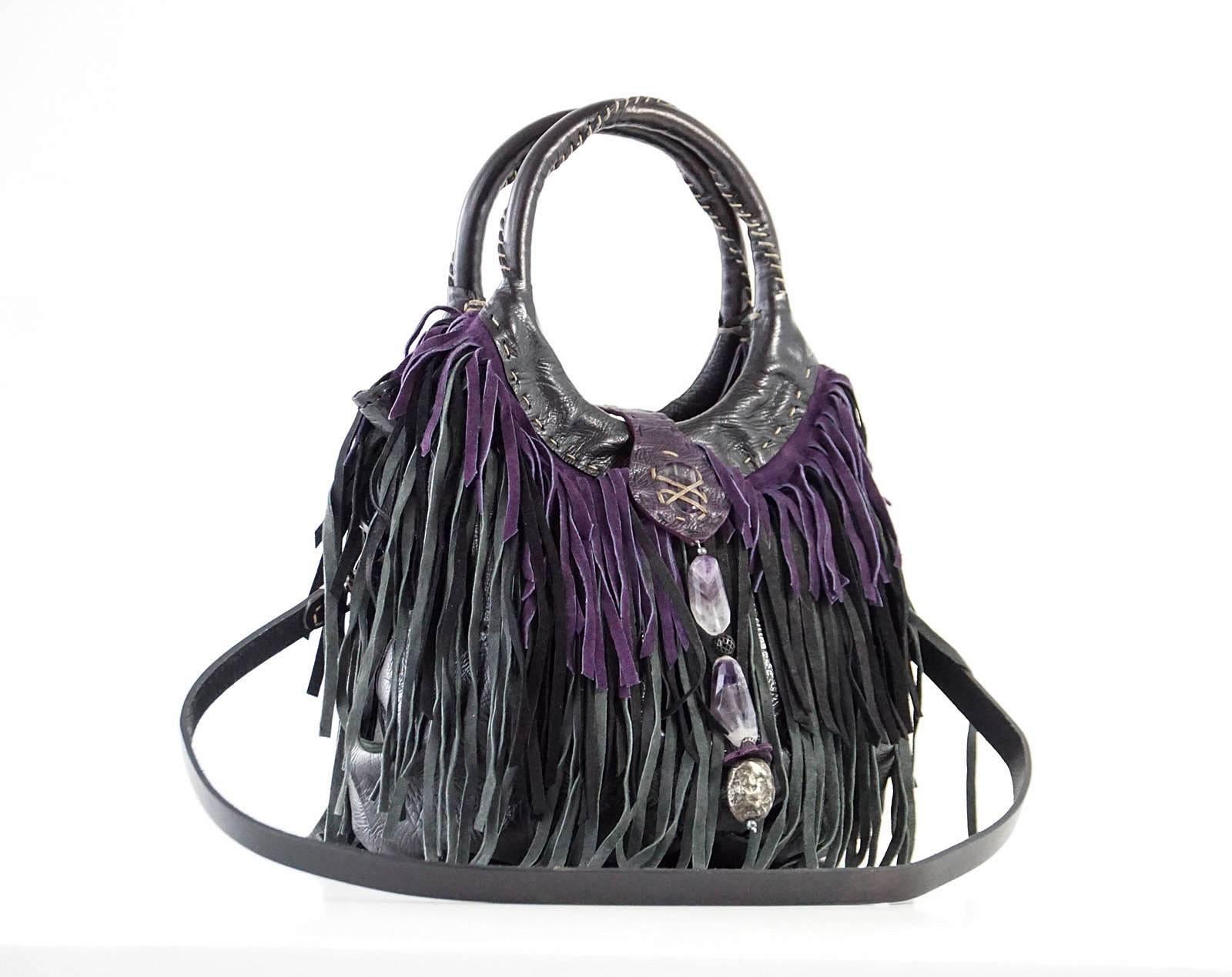 Guaranteed authentic HENRY BEGUELIN handmade fringe Folies Bijoux shoulder / handbag with detachable strap.
3 layers of suede fringe in plum, charcoal and black.
Body is leather with beautiful stitch detail.
Round handles with signature top stitch