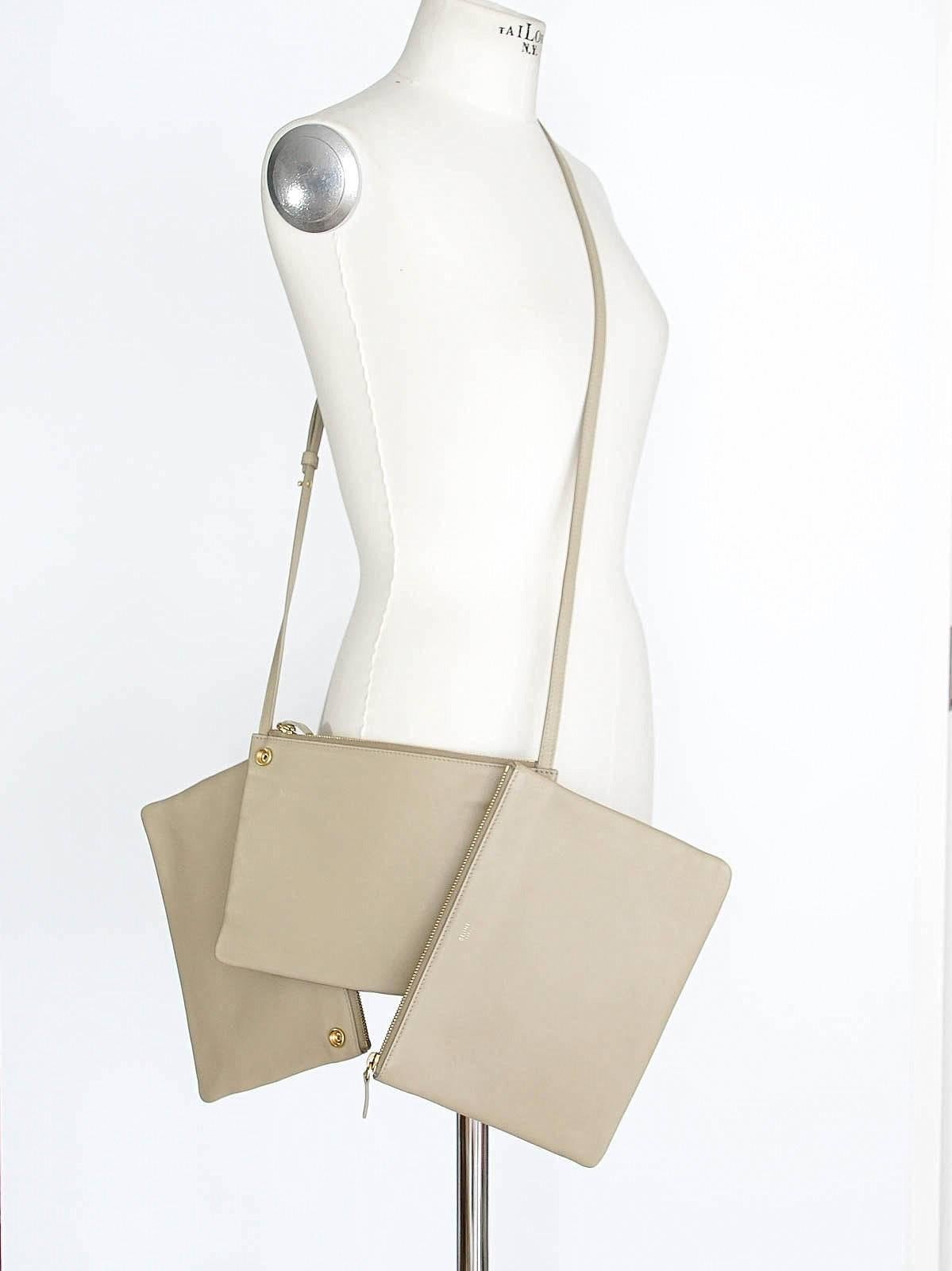 Guaranteed authentic CELINE Trio leather bag in neutral Sand.
Versatile with 3 zipper pouches 2 of which are detachable.
Adjustable strap allows bag to be carried as crossbody or shoulder.
Interior is lined in grey fabric.
CELINE PARIS stamp in gold