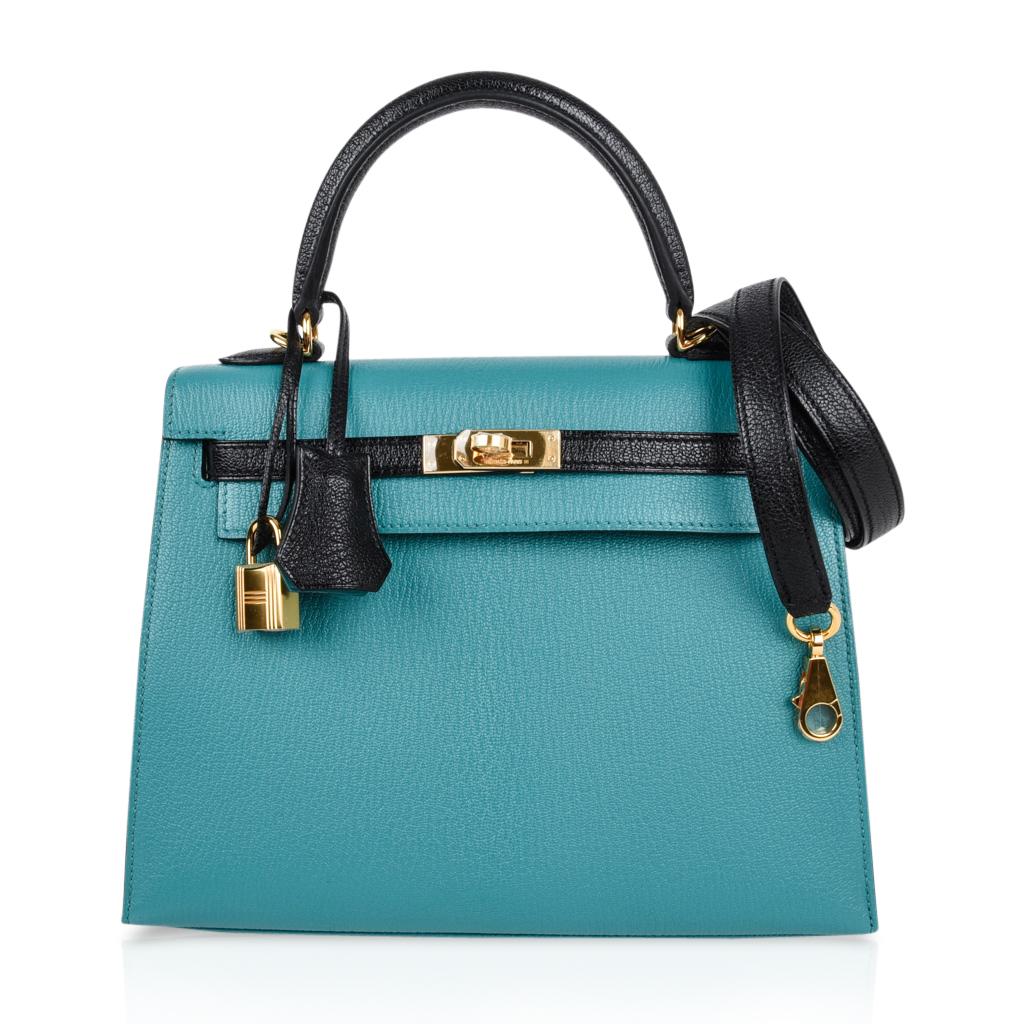 Mightychic offers an exquisite Hermes Kelly HSS Sellier 25 bag in exotic Blue Paon and Black.
This speical order Kelly bag is created in coveted Chevre Mysore leather.
Lush with Gold hardware.  
Comes with signature Hermes box, raincoat, shoulder